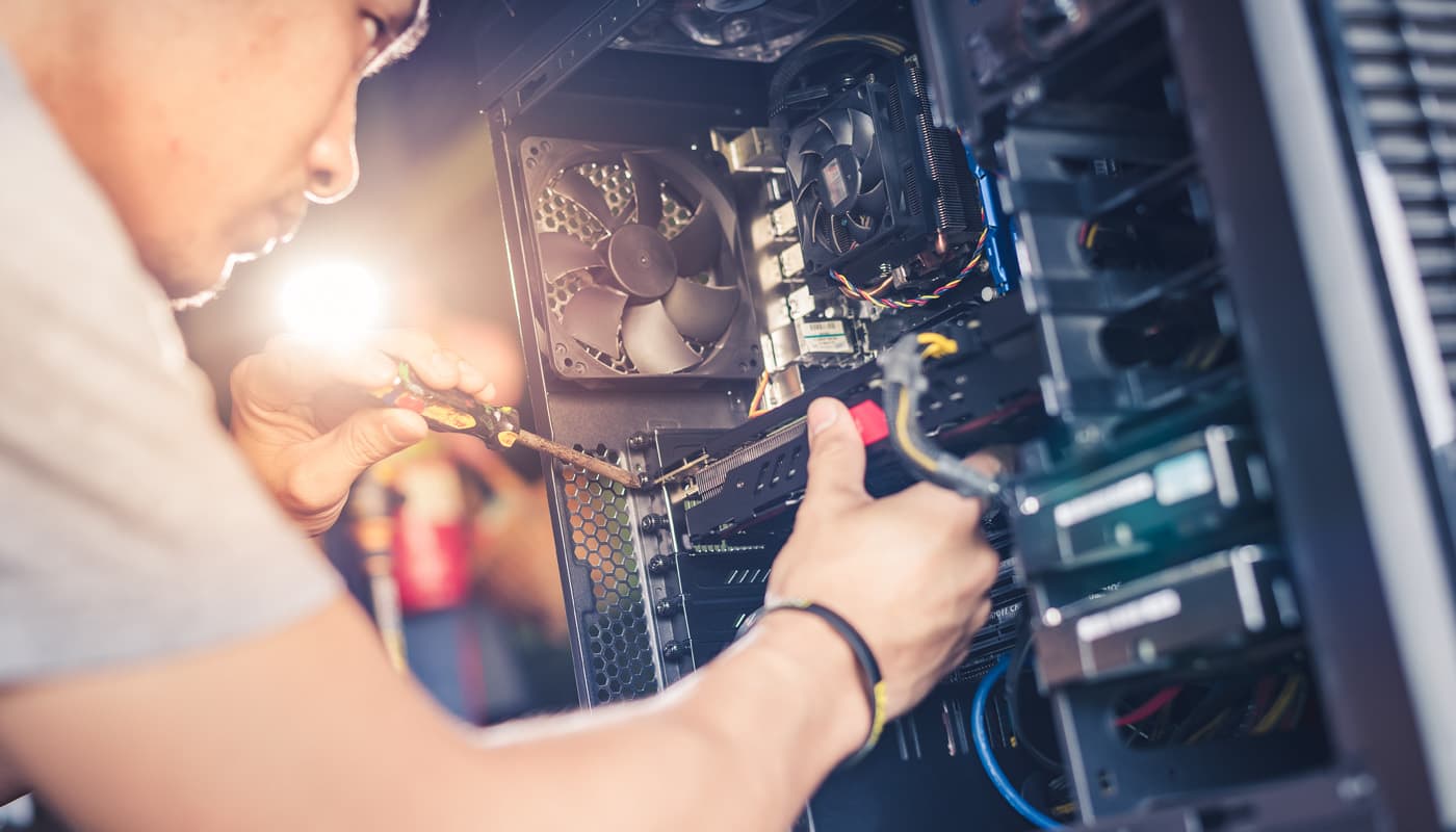 plexstar-our-help-img unscrewing a hard drive
